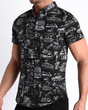 Side view of the TOILE DE MAIMI (BLACK) men’s Summer button down in black with white art with front pocket by Miami based Bang brand of men's beachwear.