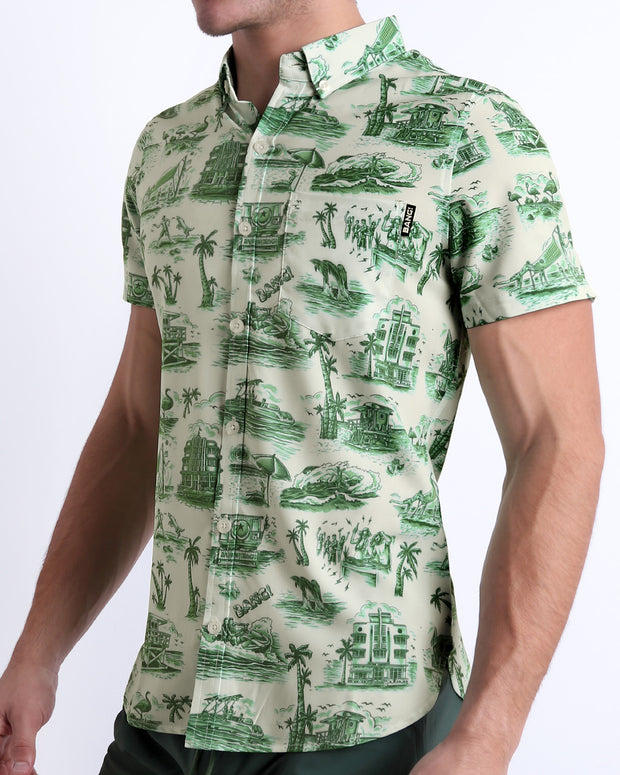 Side view of the TOILE DE MIAMI (GREEN) men’s Summer button-down in a beige color and dark green Toile de Jouy print, by BANG! Clothes in Miami.