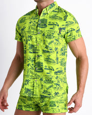 Side view of the TOILE DE MAIMI (NEON GREEN/BLUE) men’s Summer button down in bright neon green with navy blue art with front pocket by Miami based Bang brand of men's beachwear.