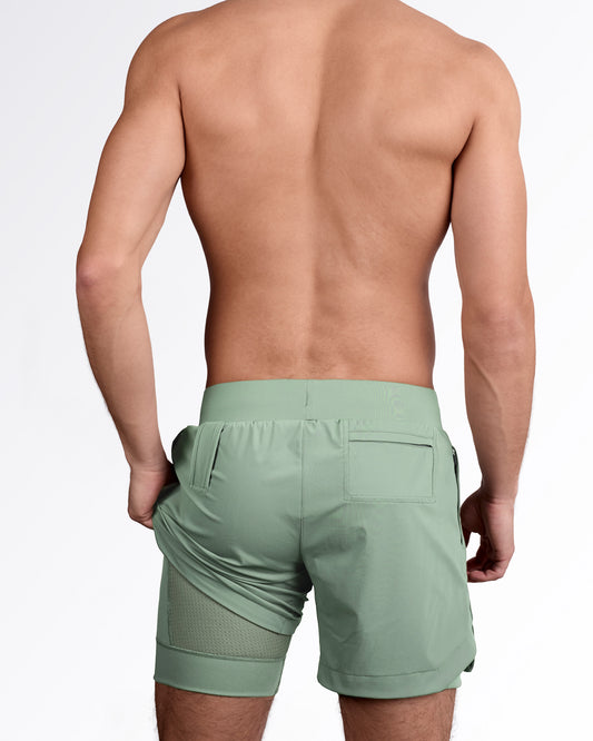 Back side of men's gym workout shorts in green forest color, showing internal liner, from DC2 Miami fitness menswear.
