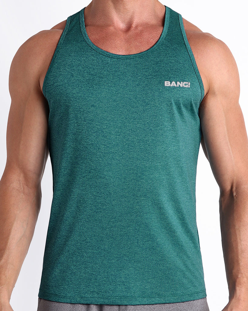 Frontal view of male model wearing the TRAINER TEAL in a solid marbled green teal color gym tank top for men by the Bang! brand of men's beachwear from Miami.