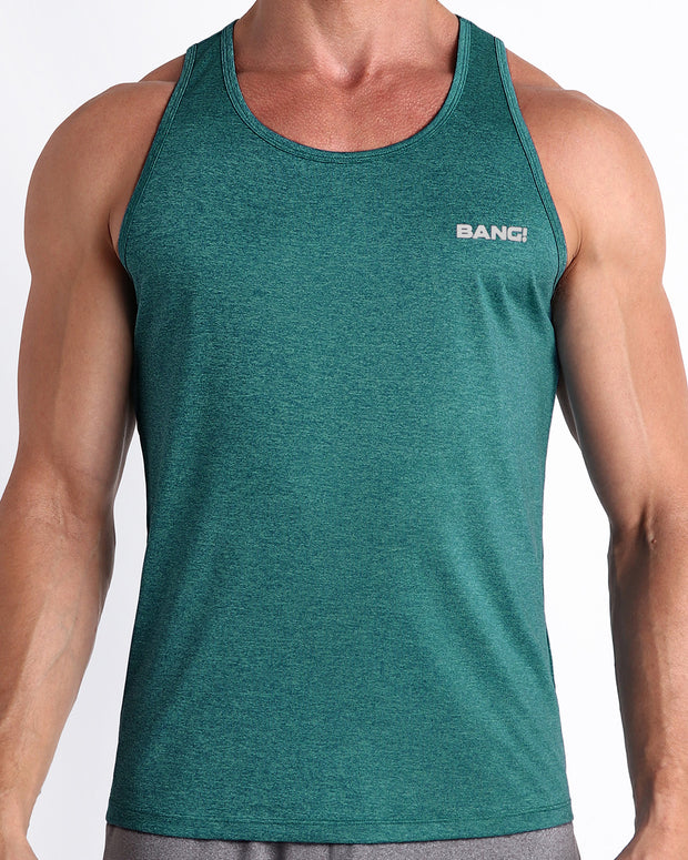 Frontal view of male model wearing the TRAINER TEAL in a solid marbled green teal color gym tank top for men by the Bang! brand of men&