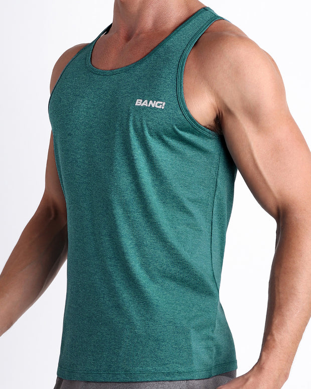 Side view of men’s workout tank top in TRAINER TEAL a marbled dark teal color with white logo made by BANG! Clothing the official brand of mens beachwear. 