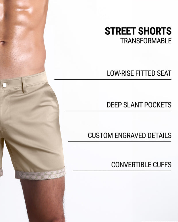 Men tailored fit chino shorts in TROPIC TAN BROWN by DC2 Keeps you feeling comfortable and looking sharp all. Classic chino shorts for men in a cotton blend from DC2 Clothing from Miami. Features two front pockets and custom engraved button front closure with zip fly. Can roll-up cuffs for shorter length and showing internal print. Or hem down for a mid-thigh length and full-solid tan brown color showing.