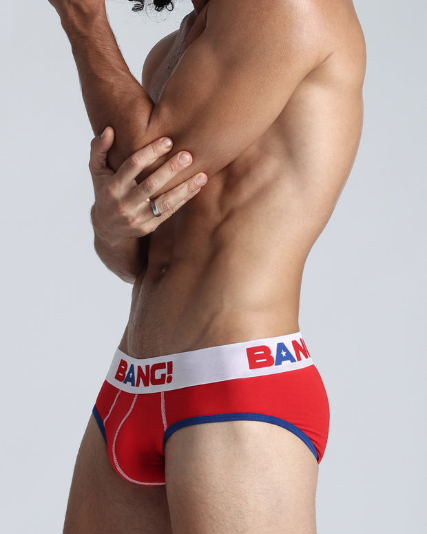 Side view of model wearing the TRIUMPH soft cotton underwear with a white buttery-soft elastic waitband with the BANG! Logo in blue and red for men by BANG! Miami the official brand of men&