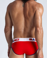 Back view of model wearing the TRIUMPH from the Sport line Men’s breathable cotton briefs in a royal blue color for men by BANG! Offers light compression for perfect contouring to the body and second-skin fit.
