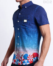 Side view of the UNDER MY UMBRELLA Hawaiian-inspired Stretch Shirt for men features a photorealistic beach scene print, complete with a front pocket, made by DC2 a capsule brand by BANG! Clothes in Miami.