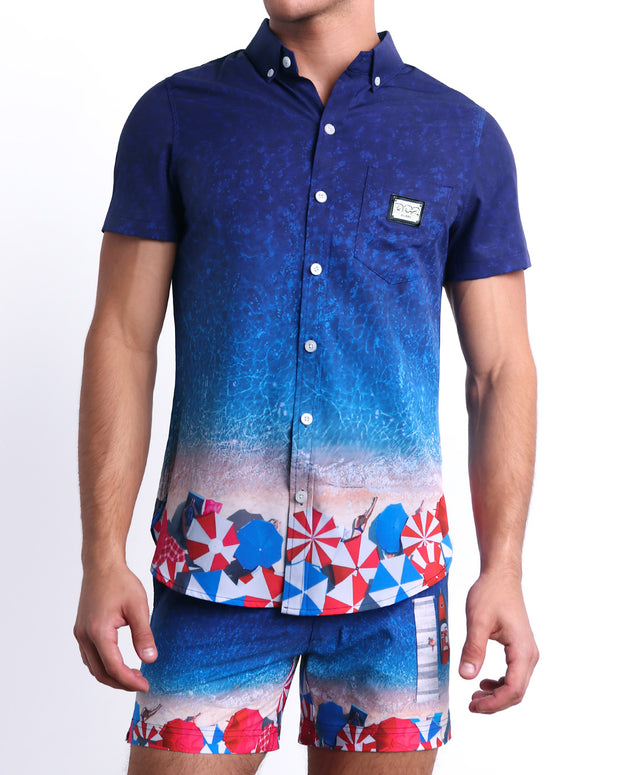 The UNDER MY UMBRELLA Tailored Shorts with the matching Stretch Shirt for men. This set is premium quality and features an ombre print of a Miami beach scene. They are designed by DC2, a men&