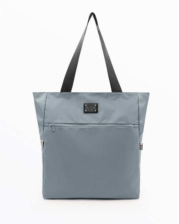 The VACAY GRAY Poolside Tote Bag by DC2 Miami, features a solid grey color. This bag is a perfect companion for beach outings, shopping trips, or everyday use.