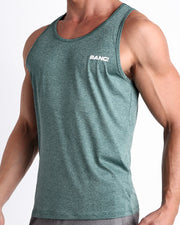 Side view of men’s workout tank top in VIKING GREEN a marbled light teal color with white logo made by BANG! Clothing the official brand of mens beachwear. 