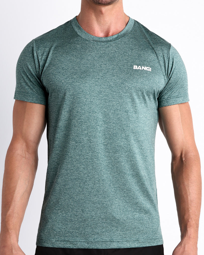 Frontal view of male model wearing the VIKING GREEN in a solid marbled teal green color quick-dry workout shirt by the Bang! brand of men's beachwear from Miami.
