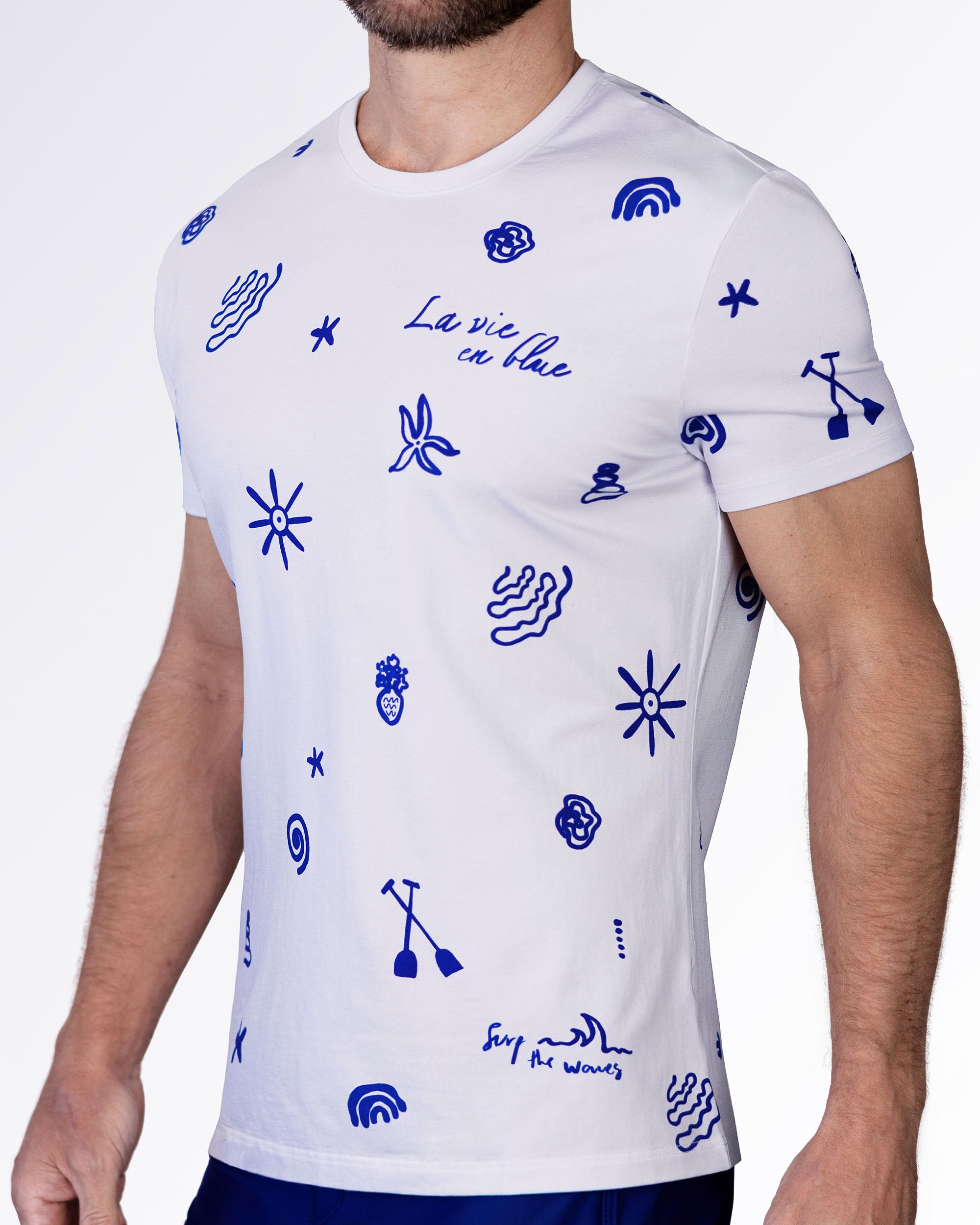 Side view of the Viva La Vida (Blue) cotton T-shirt with bold blue doodle graphics, crewneck collar, and fitted short sleeves.