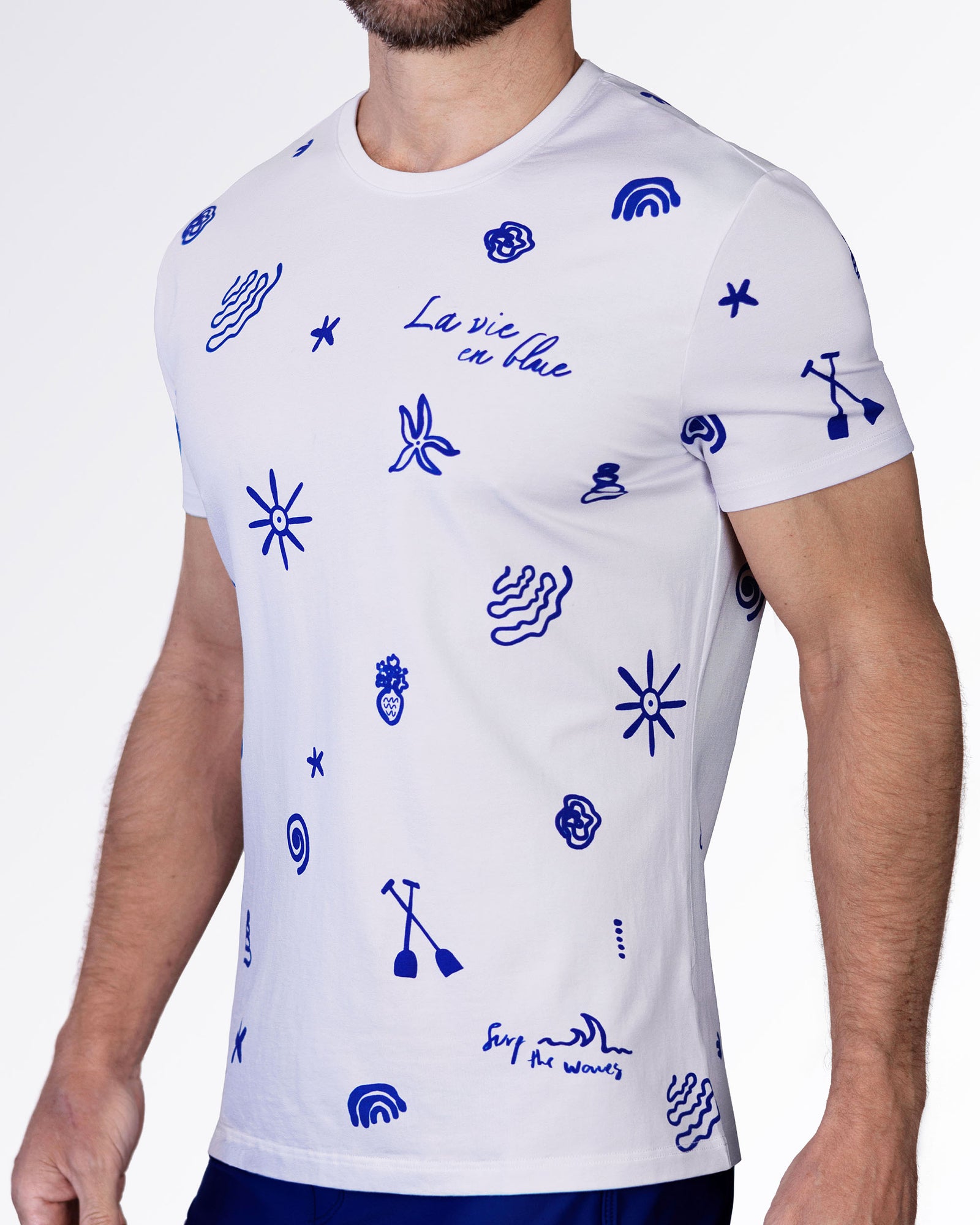Side view of the Viva La Vida (Blue) cotton T-shirt with bold blue doodle graphics, crewneck collar, and fitted short sleeves.