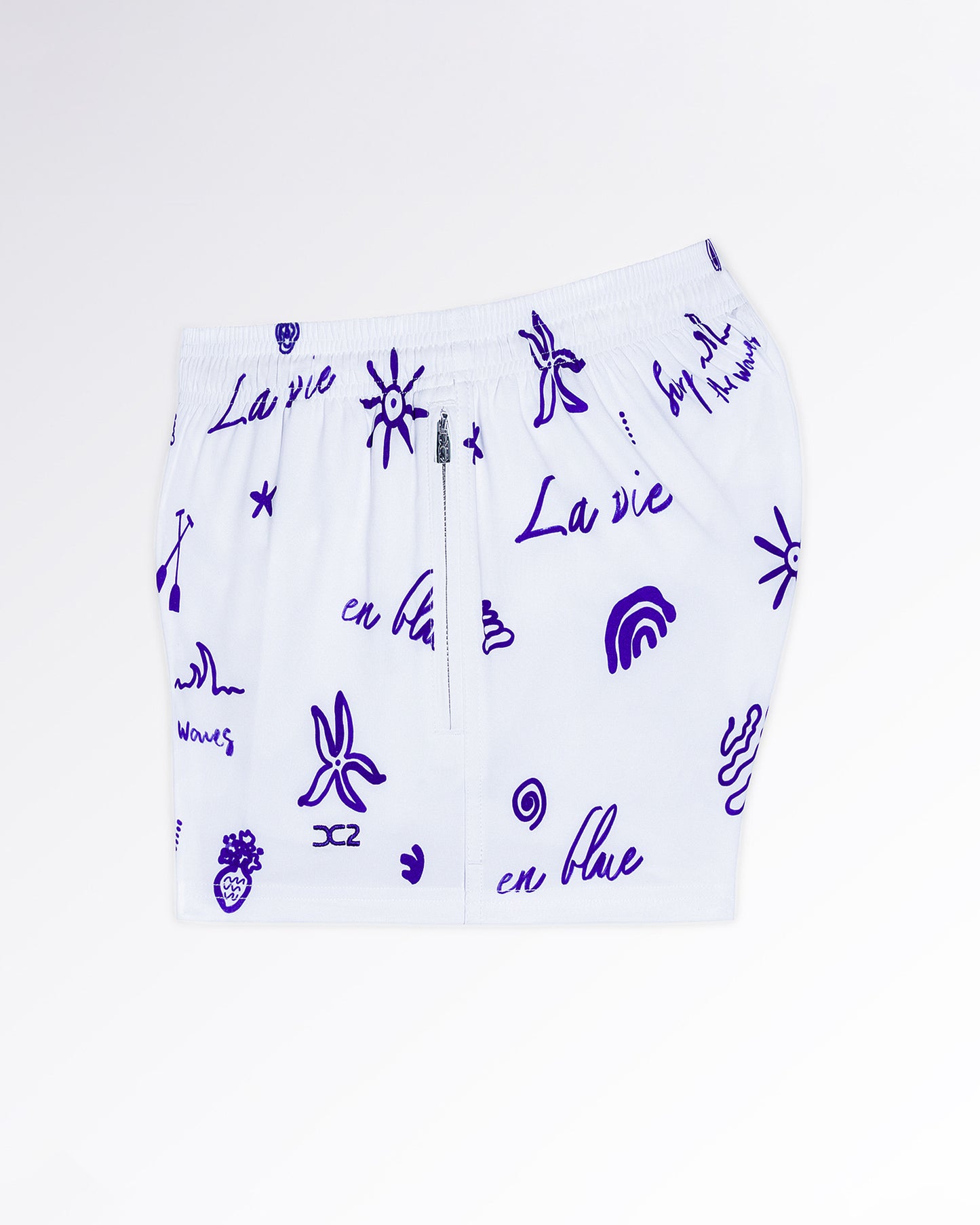 DC2 Viva La Vida (Blue) Poolside Shorts — angled flat-lay view emphasizing the lightweight fabric and playful blue icon pattern design.