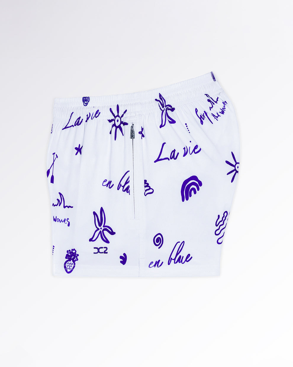 DC2 Viva La Vida (Blue) Poolside Shorts — angled flat-lay view emphasizing the lightweight fabric and playful blue icon pattern design.