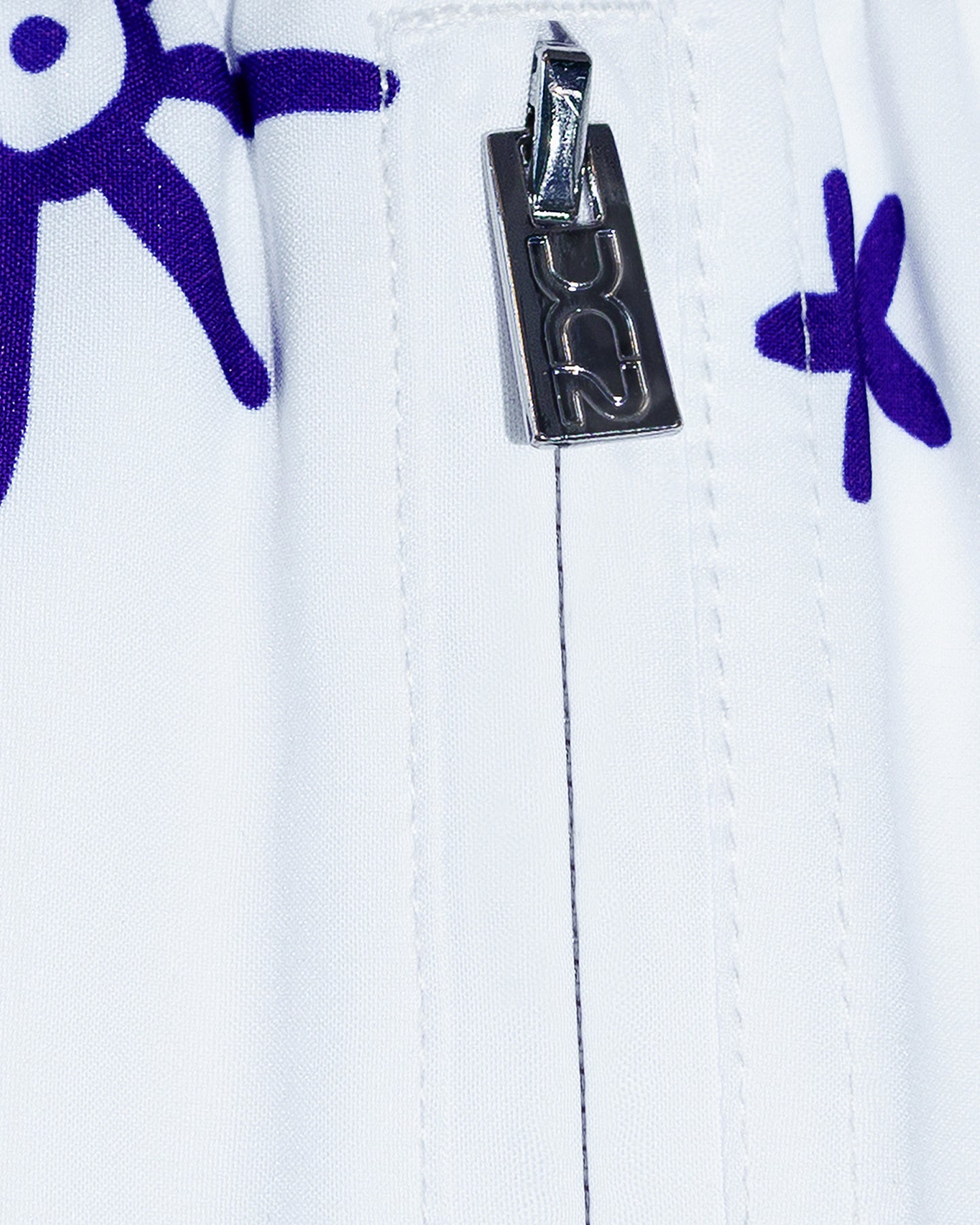 DC2 Viva La Vida (Blue) Poolside Shorts — close-up detail of the side zipper pocket with metallic DC2-branded pull tab and printed fabric.