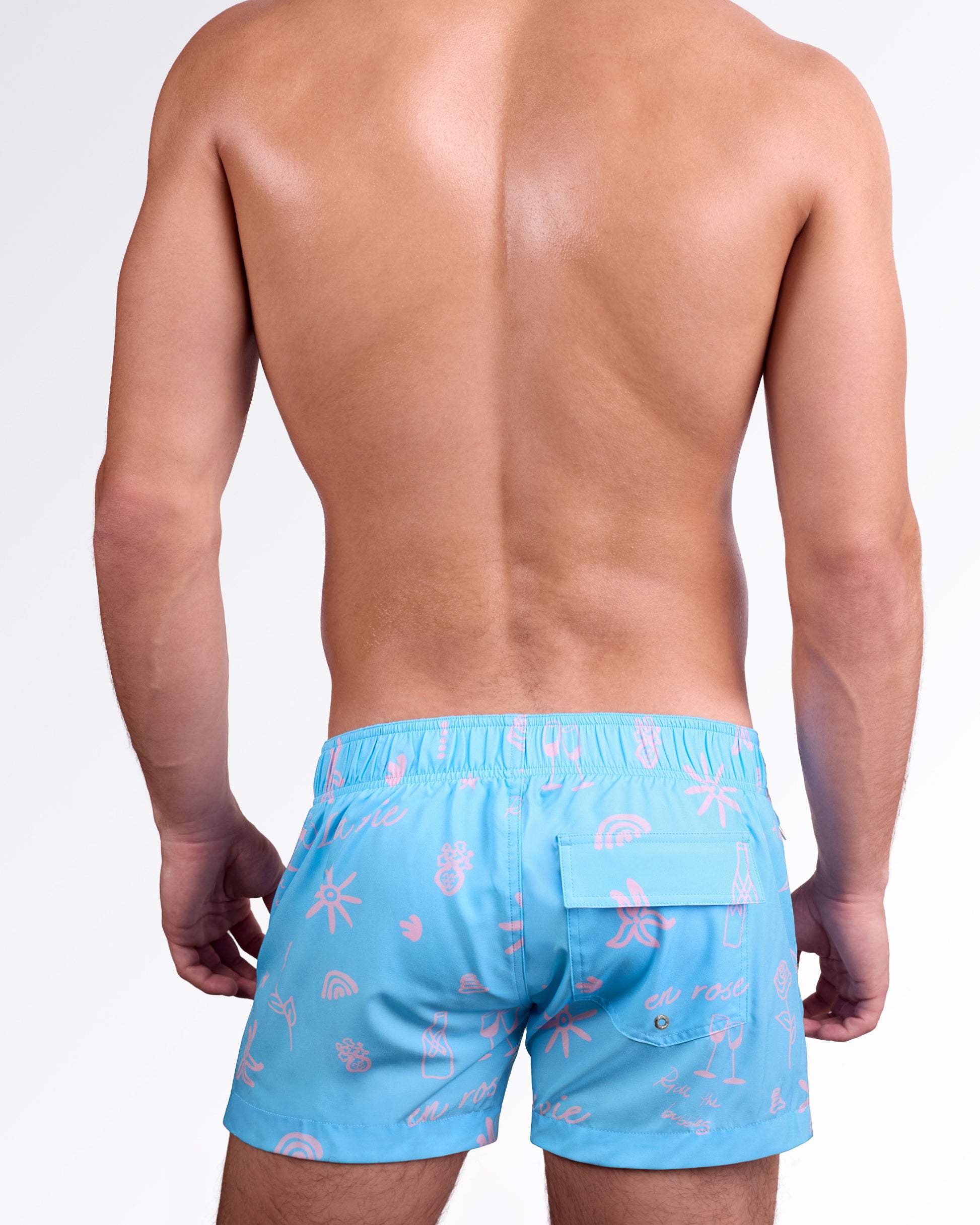 DC2 Miami Viva La Vida (En Rose) Flex Shorts — back view highlighting elastic waistband, rear pocket detail, and all-over pink illustration print on smooth quick-dry fabric.
