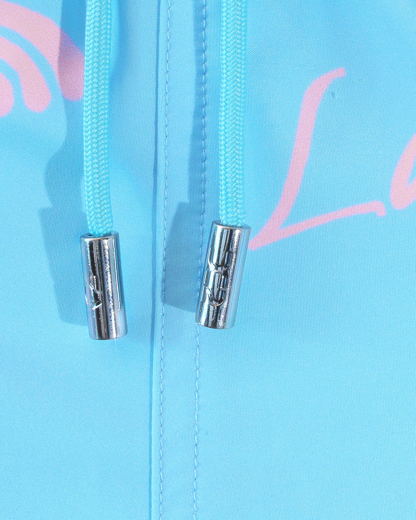 DC2 Viva La Vida (En Rose) Poolside Shorts — close-up detail of the drawstring waist with metal tips and the printed fabric texture.