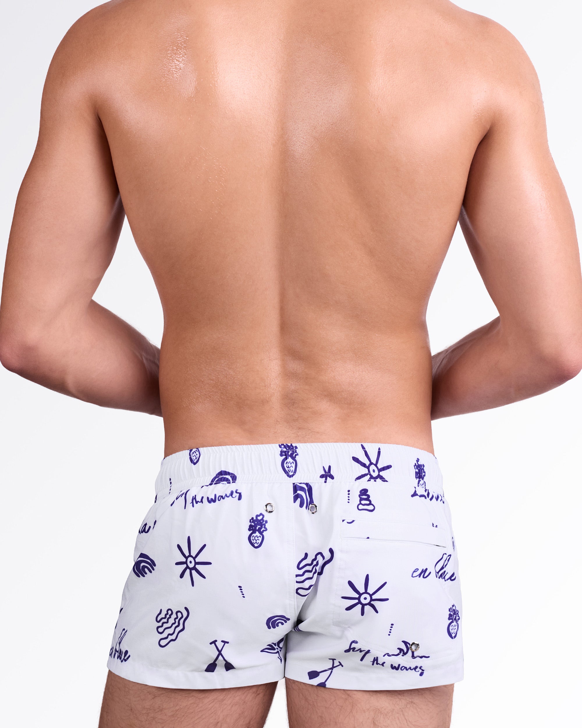 DC2 Miami Viva La Vida (Blue) Swim Mini Shorts — back view showing the allover navy print, elastic waistband, and rear pocket detail with metal eyelets.