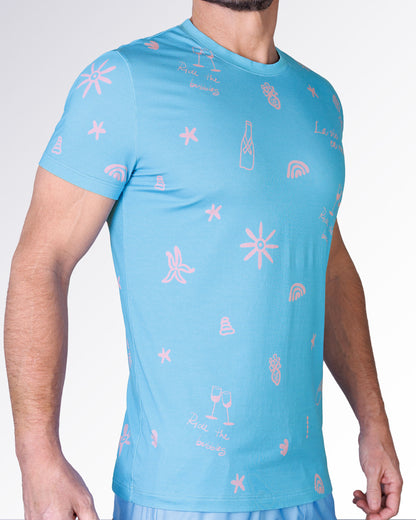 Side view of the Viva La Vida (En Rose) Cotton Graphic T-Shirt by DC2 Miami with pink doodle-style graphics on blue cotton.