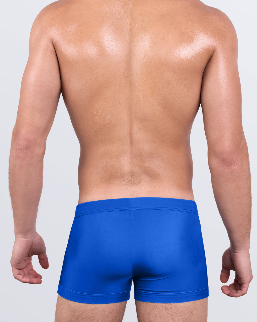 DC2 VOULEZ BLUE Swim Trunks — back view of men’s fitted swim trunks in blue, showcasing smooth streamlined design and athletic cut.