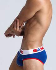 Side view of model wearing the VICTORY soft cotton underwear with a white buttery-soft elastic waitband with the BANG! Logo in blue and red for men by BANG! Miami the official brand of men's underwear.