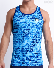 Male model wearing WET men’s casual Tank Top. A premium quality top with stylish DC2 logo monogram motif in blue, a men’s beachwear brand from Miami.