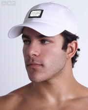 Side view of the Chillax Cap in WHITE,  a solid white color, features ventilation eyelets on the cap to provide extra breathability, perfect for active wear.