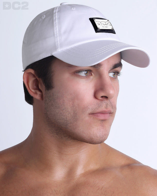 Side view of the Chillax Cap in WHITE,  a solid white color, features ventilation eyelets on the cap to provide extra breathability, perfect for active wear.