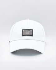 Close-up of a WHITE Baseball Cap with polished DC2 metallic silver plaque.