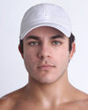DC2 Resort Cap in white worn by model, minimalist structured baseball cap with tonal embroidered logo.