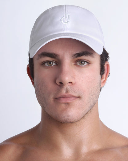 DC2 Resort Cap in white worn by model, minimalist structured baseball cap with tonal embroidered logo.