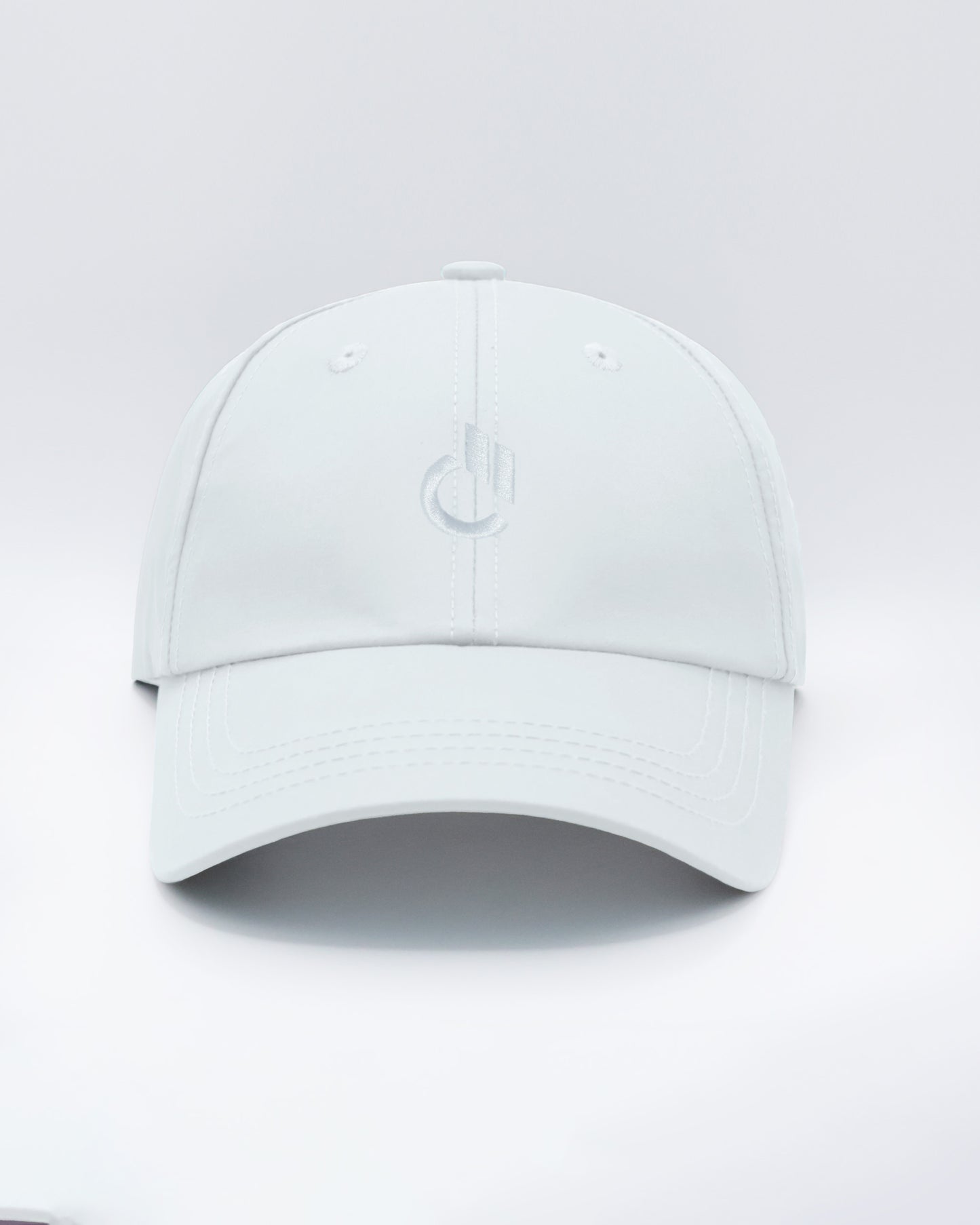 DC2 Resort Cap in White — front view showcasing a curved brim, structured crown, and tonal embroidered DC2 logo.