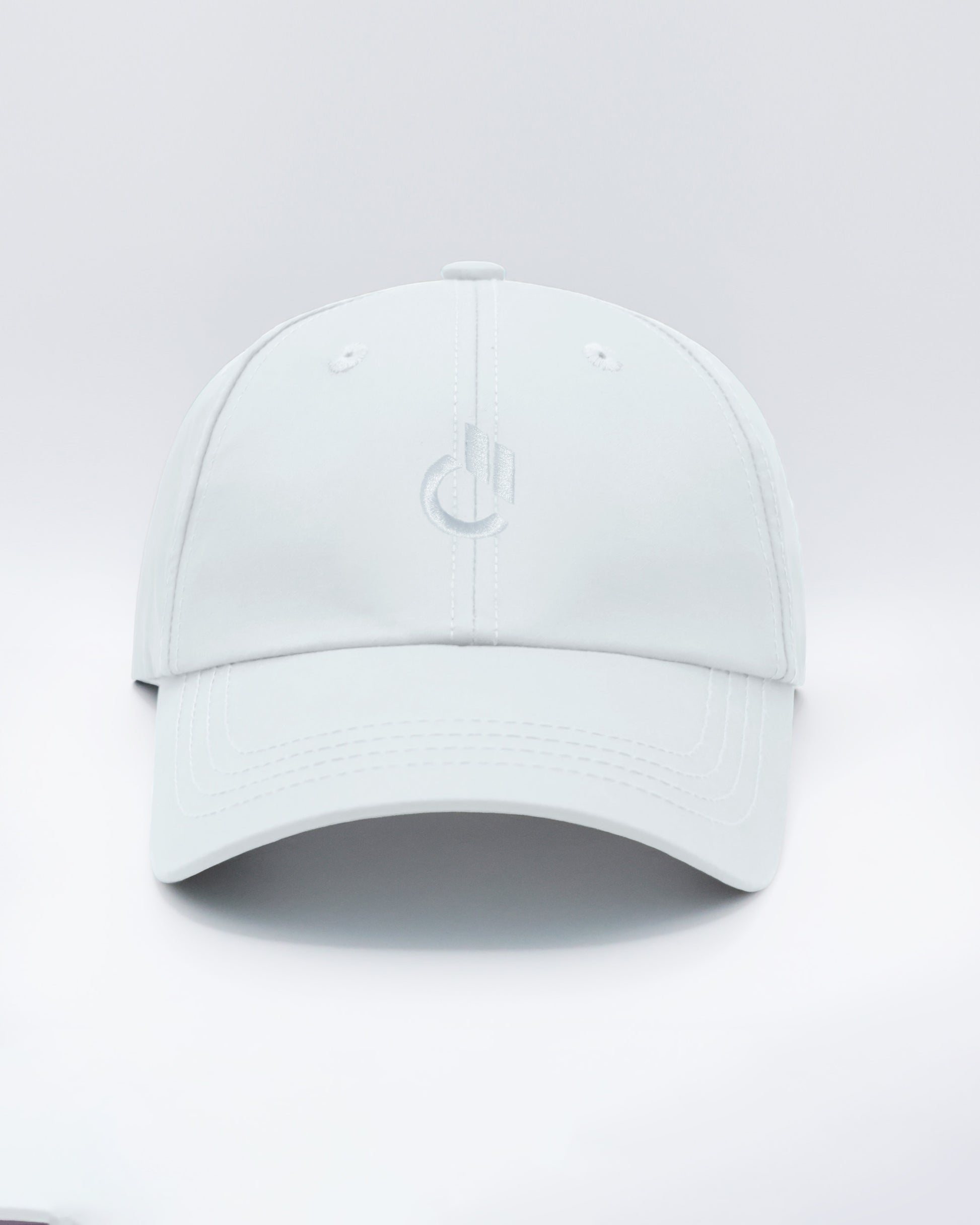 DC2 Resort Cap in White — front view showcasing a curved brim, structured crown, and tonal embroidered DC2 logo.