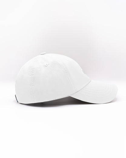 DC2 Resort Cap in White — side view showing the low-profile fit, curved brim, and smooth cotton twill finish.