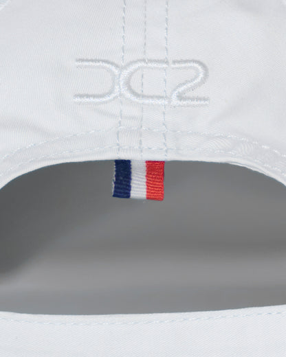Back detail of the DC2 Resort Cap in White — featuring tonal stitching and a woven tricolor accent tab.

