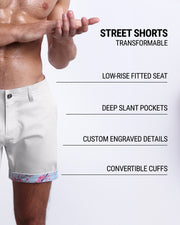 Men tailored fit chino shorts in WHITE LOTUS by DC2 Keeps you feeling comfortable and looking sharp all. Classic chino shorts for men in a cotton blend from DC2 Clothing from Miami. Features two front pockets and custom engraved button front closure with zip fly. Can roll-up cuffs for shorter length and showing internal print. Or hem down for a mid-thigh length and full-solid white color showing.