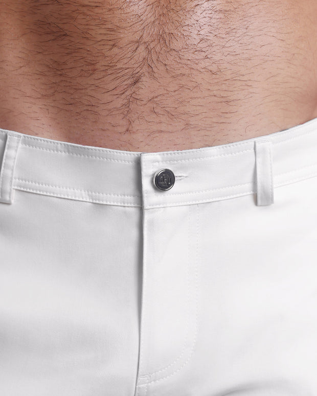 Close up view of cotton fabric chino street shorts with custom engraved front tack button in a silver finish by DC2 men&