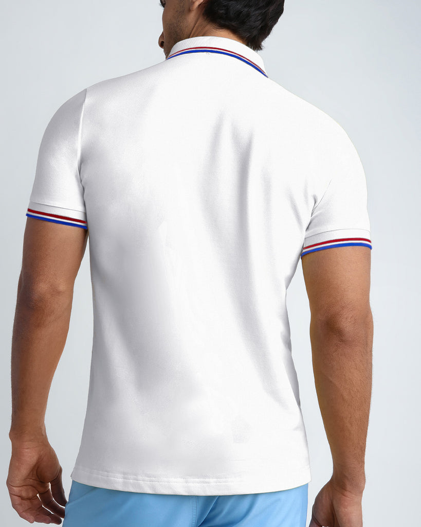 Back view of a sexy model wearing the WHITE O'CLOCK short-sleeve classic polo shirt for men in a white color from BANG! Clothing the official brand for menswear.