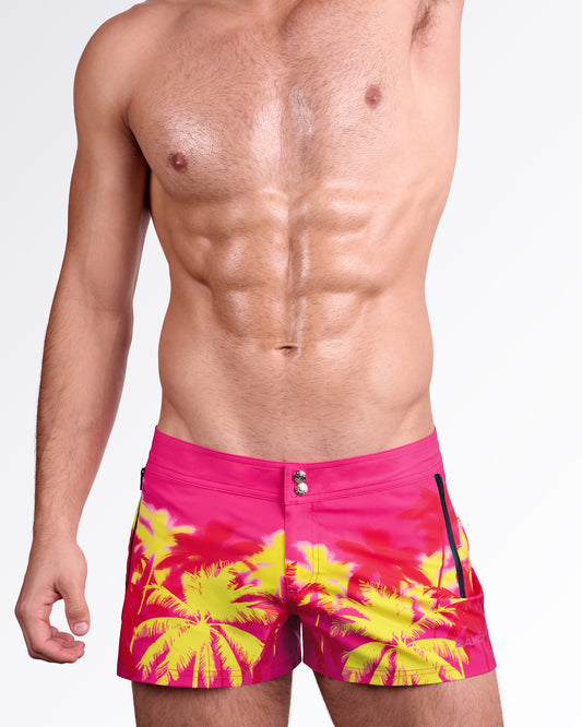 BANG Wuthering Heights (Fucsia) Beach Shorts — back view showcasing the tropical palm print, rear pocket detail, and sleek resort-ready beach fit.