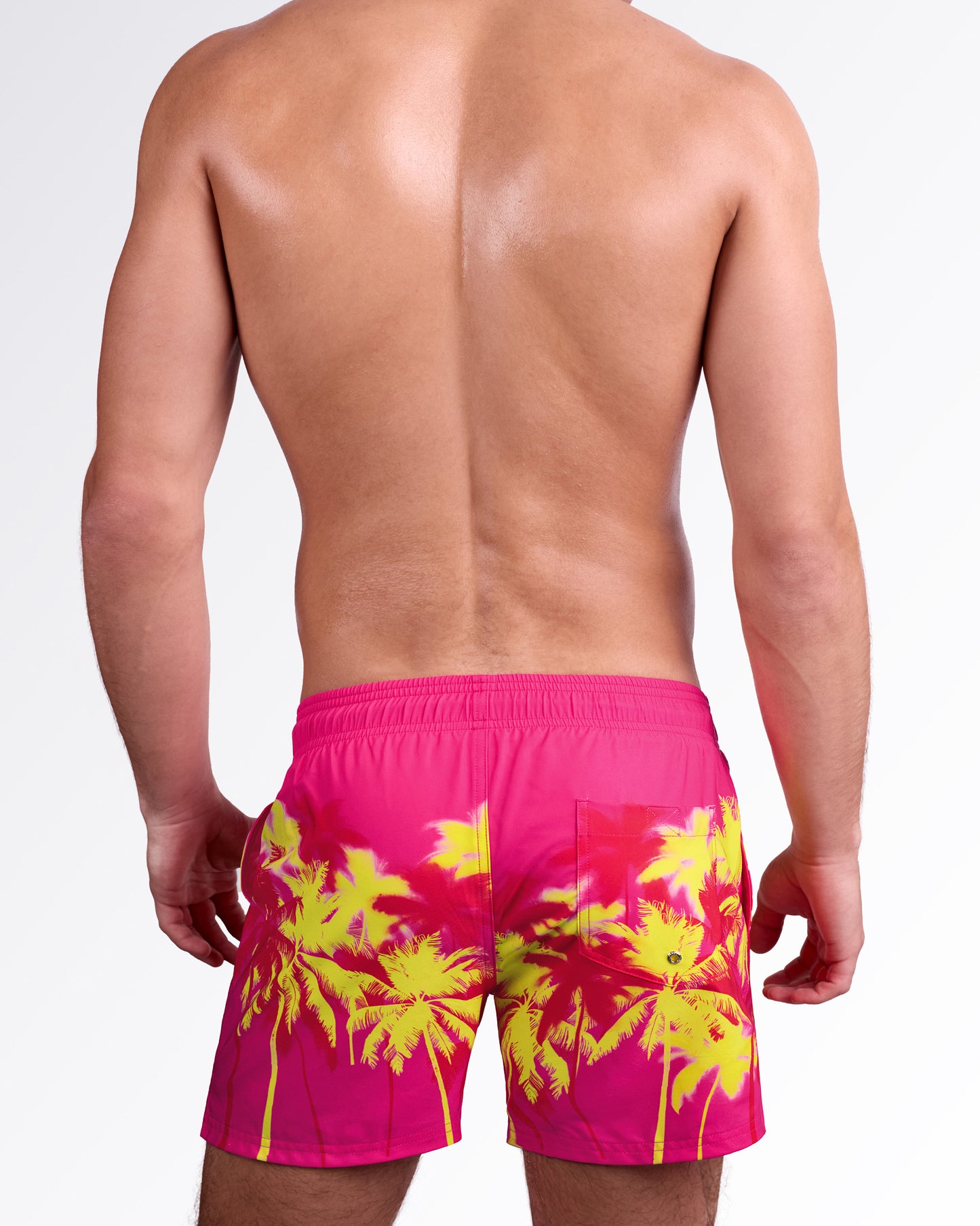 BANG! Miami Wuthering Heights (Fucsia) Resort Shorts — back view highlighting elastic waistband, rear pocket detail, and bold palm tree silhouette print on lightweight quick-dry fabric.