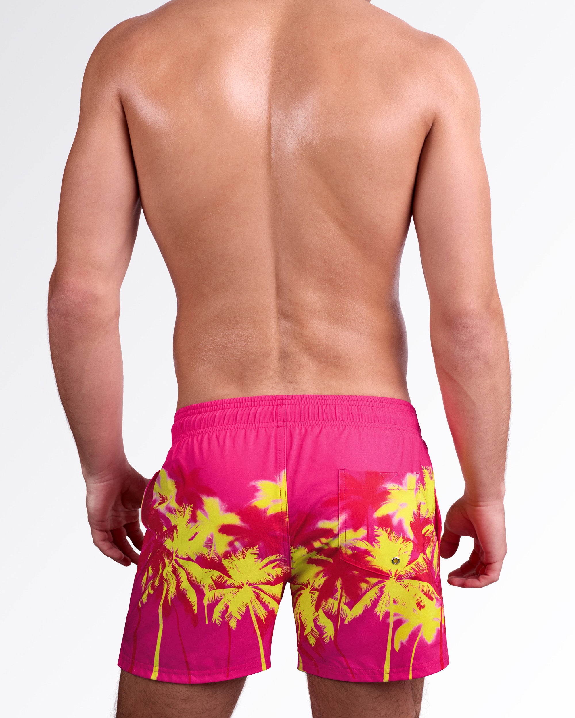 BANG! Miami Wuthering Heights (Fucsia) Resort Shorts — back view highlighting elastic waistband, rear pocket detail, and bold palm tree silhouette print on lightweight quick-dry fabric.