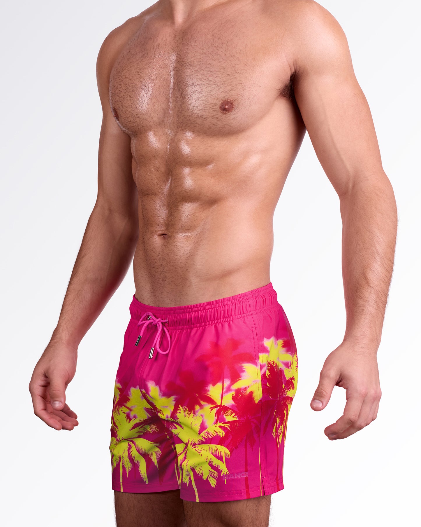 BANG! Miami Wuthering Heights (Fucsia) Resort Shorts — side angle view showcasing vibrant fucsia base, palm print placement, and comfortable resort silhouette.