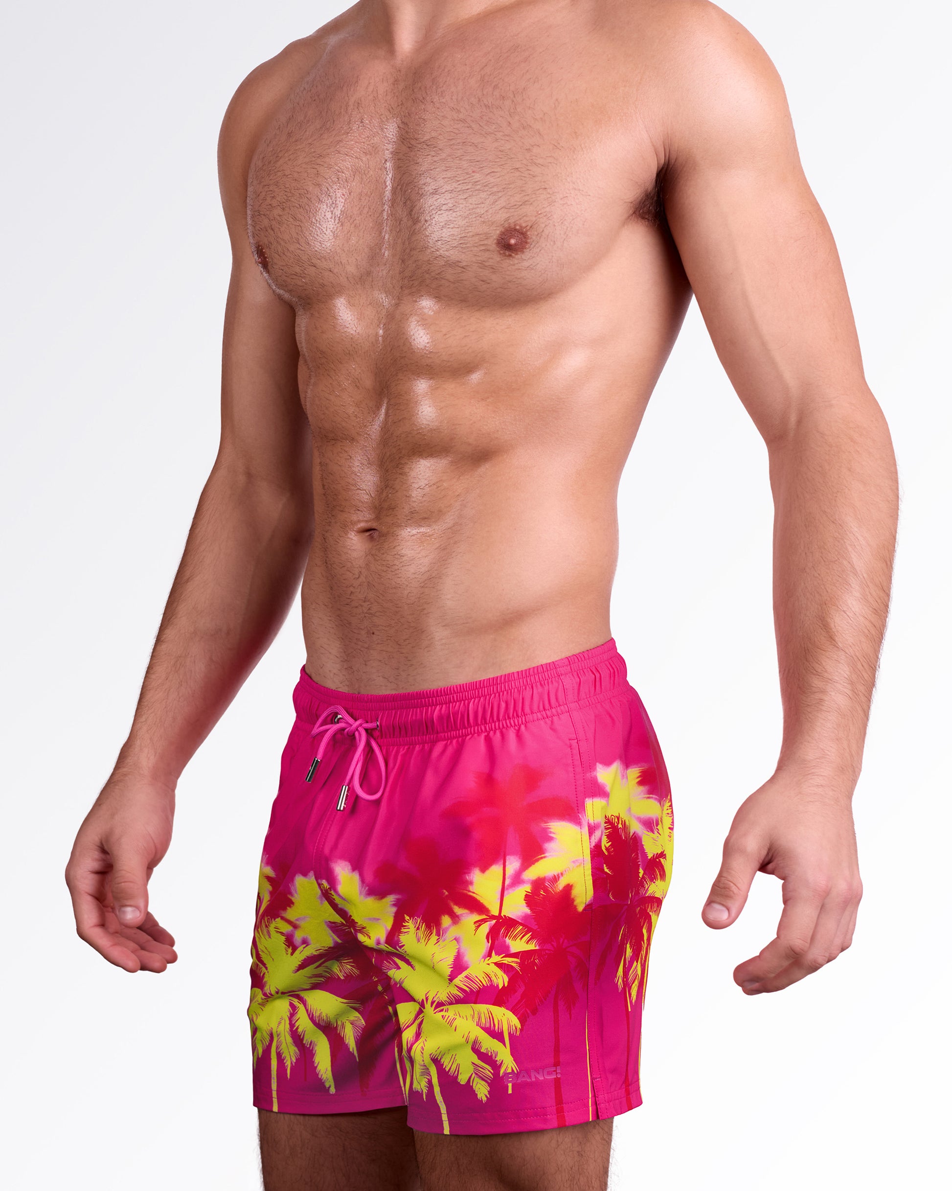 BANG! Miami Wuthering Heights (Fucsia) Resort Shorts — side angle view showcasing vibrant fucsia base, palm print placement, and comfortable resort silhouette.