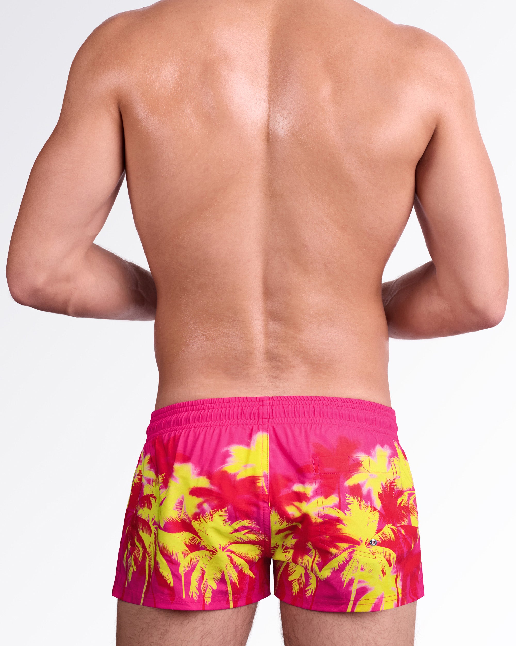 BANG Wuthering Heights (Fucsia) Show Shorts — back view highlighting the striking tropical palm print, rear pocket detail, and fitted design made for standout poolside style.