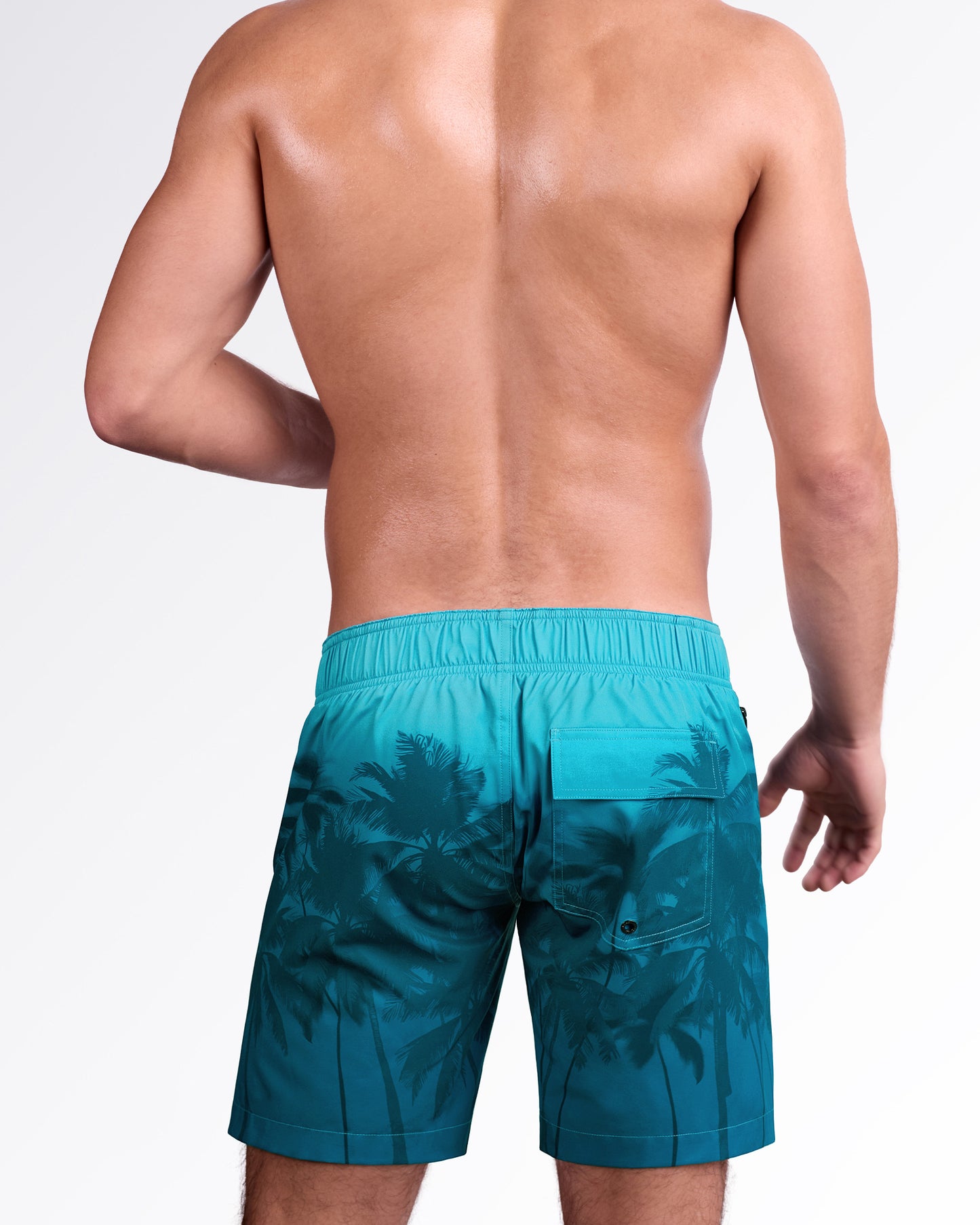 BANG Wuthering Heights (Shades) Flex Boardshorts — back view highlighting the tropical palm shadow print, elastic back waistband, and rear flap pocket detail.