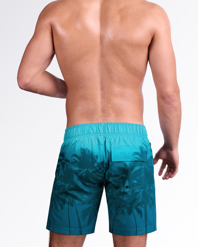 BANG Wuthering Heights (Shades) Flex Boardshorts — back view highlighting the tropical palm shadow print, elastic back waistband, and rear flap pocket detail.