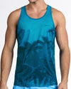 BANG Wuthering Heights (Shades) Gym Tank Top — model wearing teal gradient men’s tank featuring tonal palm tree silhouettes and subtle BANG logo at chest.