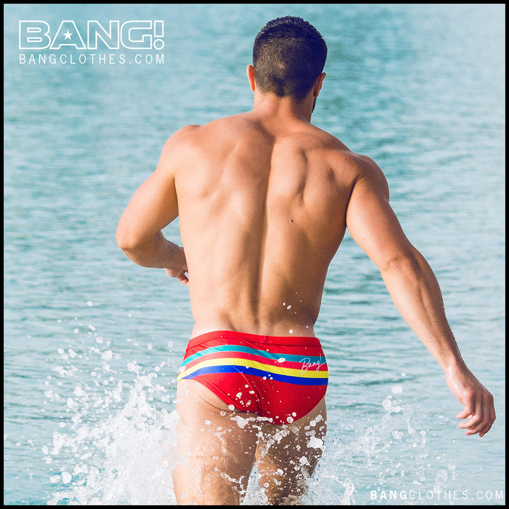 Frontal view of model wearing Stripe'A'Pose ROUX men’s swimwear by the Bang! Clothes brand of men's beachwear from Miami.