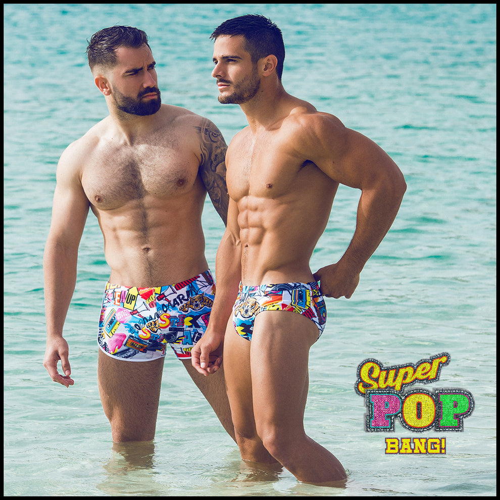 Frontal view of a hot male model in the ocean wearing premium BANG! swim brief made in Miami Florida